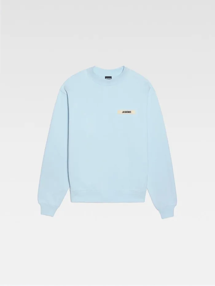 JACQUEMUS The Gros Grain Sweatshirt Light Blue WomenMen Sweatshirts and Joggings JACQUEMUS The Gros Grain Sweatshirt Light Blue WomenMen Sweatshirts and Joggings