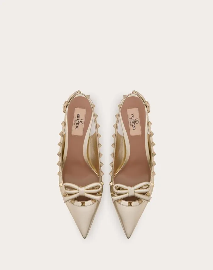 Valentino Pumps Woman Rockstud Bow Slingback Pumps In Laminated Nappa Leather And 60mm Tone Studs For Woman In Platinum Platinum
