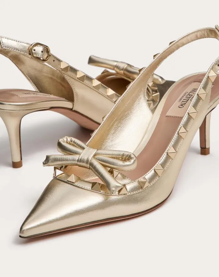 Valentino Pumps Woman Rockstud Bow Slingback Pumps In Laminated Nappa Leather And 60mm Tone Studs For Woman In Platinum Platinum