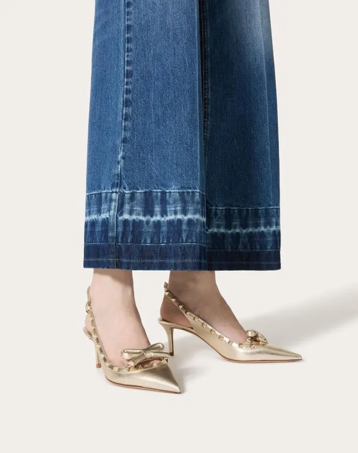 Valentino Pumps Woman Rockstud Bow Slingback Pumps In Laminated Nappa Leather And 60mm Tone Studs For Woman In Platinum Platinum