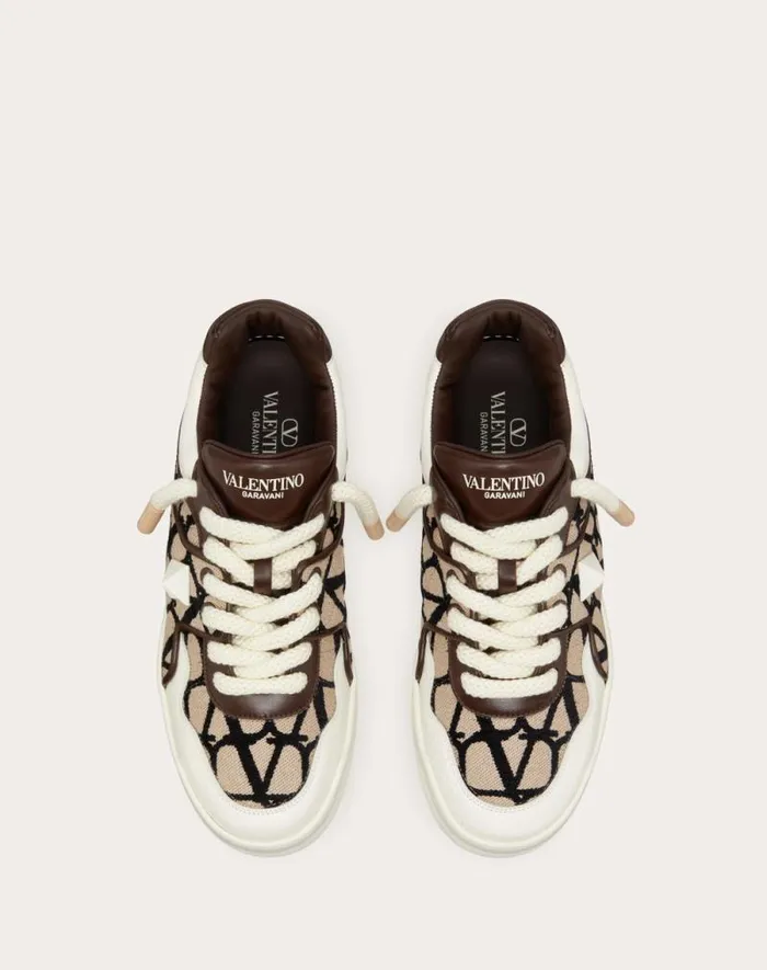 Valentino Sneakers Man One Stud Xl Lowtop Sneaker In Nappa Leather And Toile Iconographe Fabric For Man In Beigeblack Beigeblack Valentino Sneakers Man One Stud Xl Lowtop Sneaker In Nappa Leather And Toile Iconographe Fabric For Man In Beigeblack Beigeblack