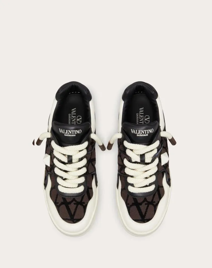 Valentino Sneakers Man One Stud Xl Lowtop Sneaker In Nappa Leather And Toile Iconographe Fabric For Man In Beigeblack Beigeblack Valentino Sneakers Man One Stud Xl Lowtop Sneaker In Nappa Leather And Toile Iconographe Fabric For Man In Beigeblack Beigeblack