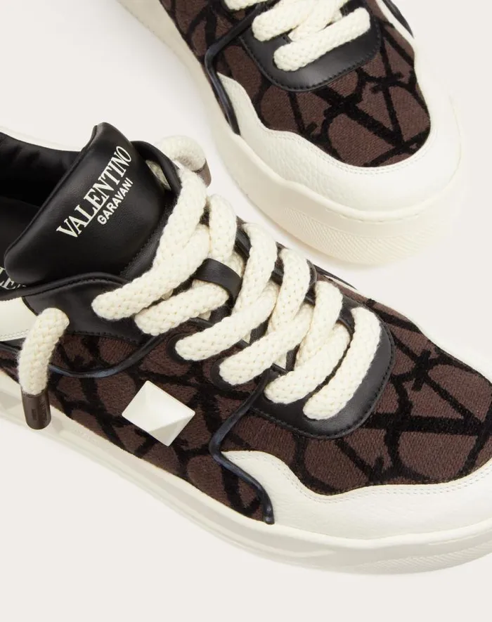 Valentino Sneakers Man One Stud Xl Lowtop Sneaker In Nappa Leather And Toile Iconographe Fabric For Man In Beigeblack Beigeblack Valentino Sneakers Man One Stud Xl Lowtop Sneaker In Nappa Leather And Toile Iconographe Fabric For Man In Beigeblack Beigeblack