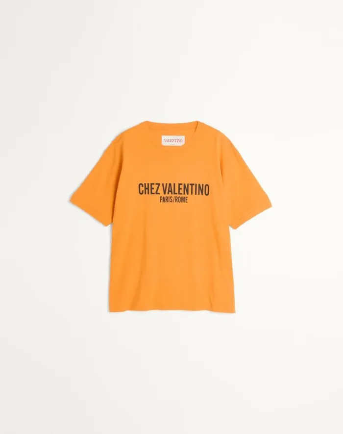 Valentino Tshirts And Sweatshirts Man Cotton Tshirt With Chez Valentino Print For Man In Orange Orange Valentino Tshirts And Sweatshirts Man Cotton Tshirt With Chez Valentino Print For Man In Orange Orange
