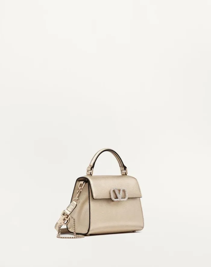 Valentino Top Handle Bags Woman Mini Vsling Handbag In Metallic Grainy Calfskin For Woman In Platinumcrystal Platinumcrystal Valentino Top Handle Bags Woman Mini Vsling Handbag In Metallic Grainy Calfskin For Woman In Platinumcrystal Platinumcrystal