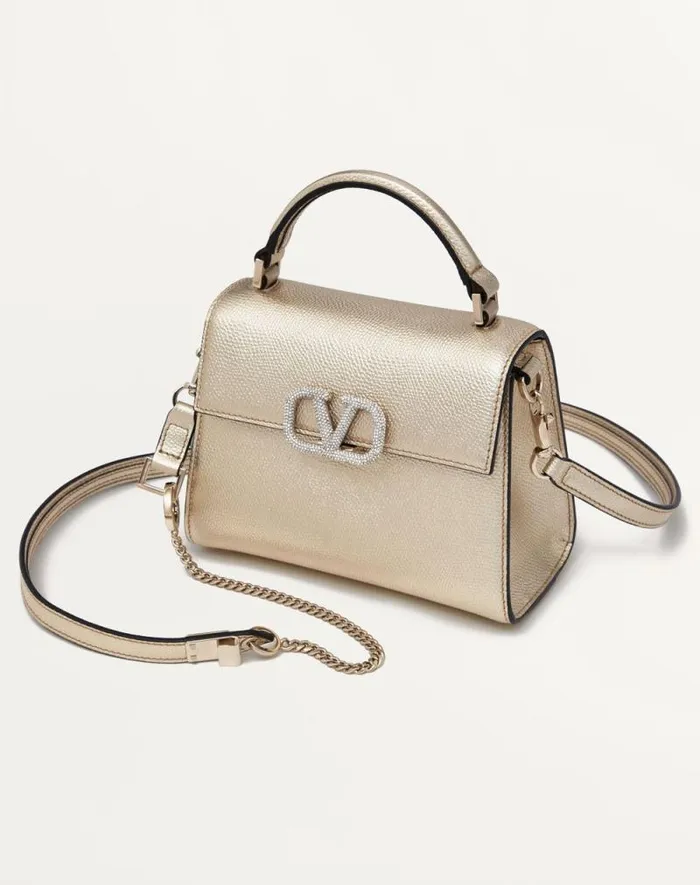 Valentino Top Handle Bags Woman Mini Vsling Handbag In Metallic Grainy Calfskin For Woman In Platinumcrystal Platinumcrystal Valentino Top Handle Bags Woman Mini Vsling Handbag In Metallic Grainy Calfskin For Woman In Platinumcrystal Platinumcrystal