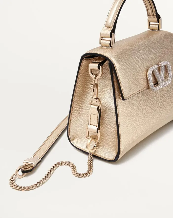 Valentino Top Handle Bags Woman Mini Vsling Handbag In Metallic Grainy Calfskin For Woman In Platinumcrystal Platinumcrystal Valentino Top Handle Bags Woman Mini Vsling Handbag In Metallic Grainy Calfskin For Woman In Platinumcrystal Platinumcrystal